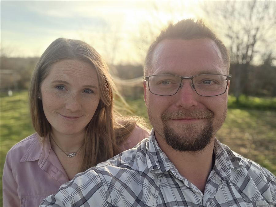 Rianna and Jamon Mysliwiec at golden hour on their Ozarks homestead